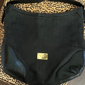 Michael Kors Black Hobo Bag with Gold Accents